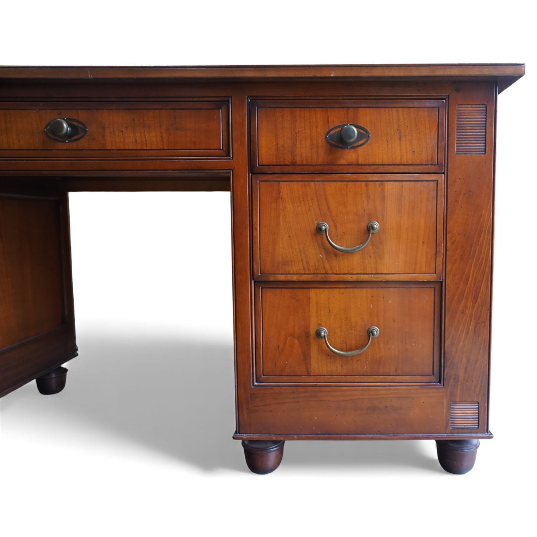And So To Bed - French cherry wood twin pedestal dressing table, the rectangular top over seven drawers arranged with a central drawer and three drawers to each pedestal, panelled sides with louvred detail, raised on turned bun feet
