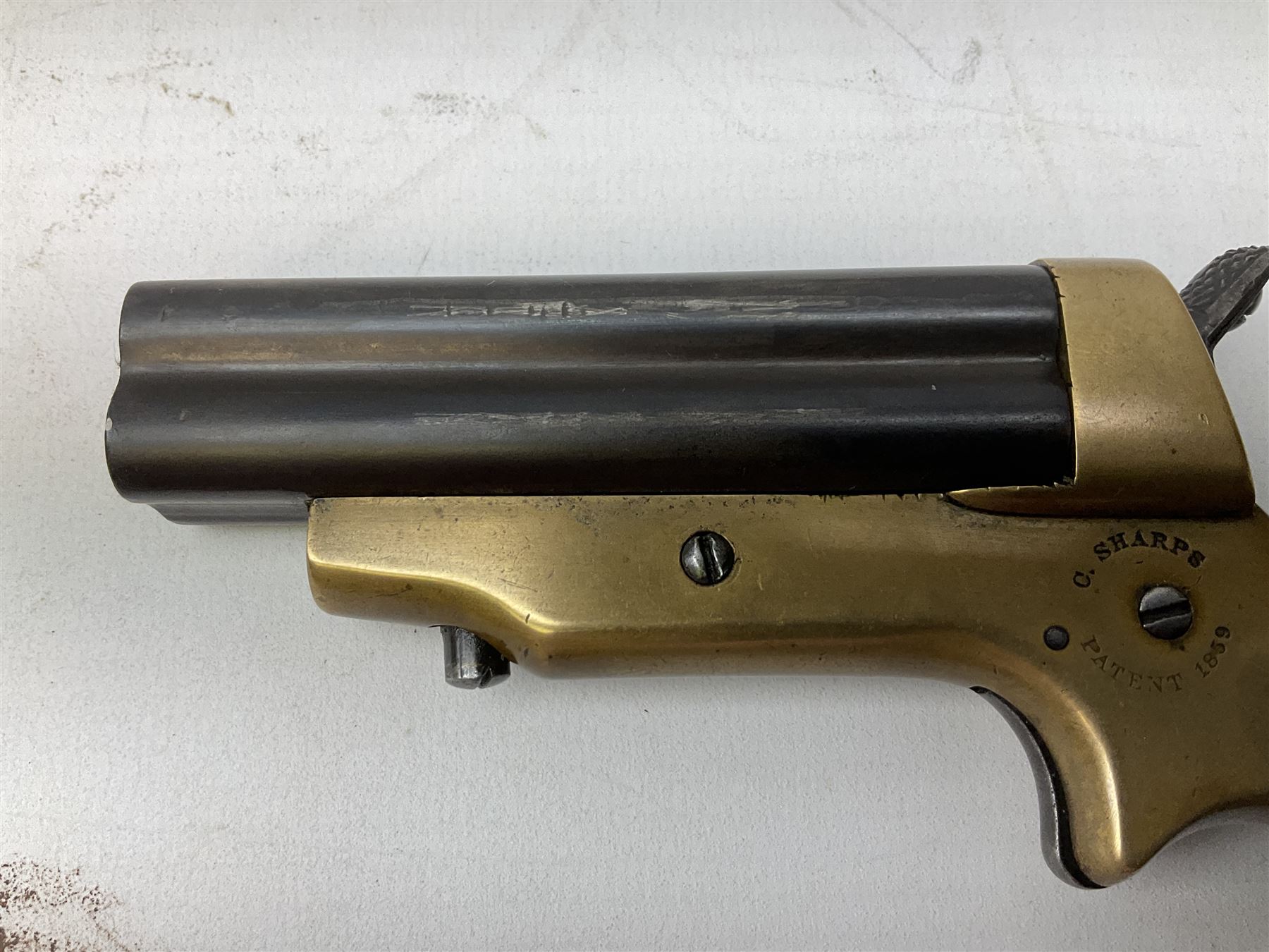 Mid-19th century Sharps' Patent Repeater four-barrelled Deringer pistol, dated 1859, approximately .30 calibre rim fire, brass bodied with rotating firing pin, serial no.8767, L16cm; in fitted rosewood box with label under lid, rack of ten deactivated cartridges, oil bottle and screwdriver and owner's name in brass cartouche to lid.