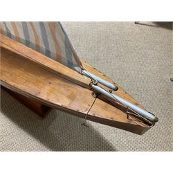Large pond yacht with simulated planked mahogany deck, mahogany hull, wooden keel and stern fin and tubular aluminium mast with two sails; on wooden stand L131cm H on stand 177cm