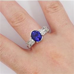 18ct white gold tanzanite and diamond ring, oval tanzanite, with baguette and round brilliant cut diamond surround, stamped 18k, tanzanite approx 2.80 carat, total diamond weight 0.60 carat
