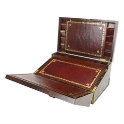19th century brass bound mahogany writing slope with twin drop carry handles to sides, the hinged cover opening to reveal a  gilt tooled burgundy leather slope and compartmented interior, H22xm W50.5cm D30cm