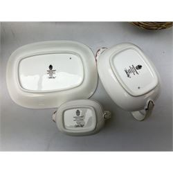 Wedgwood dinner service decorated in the 'Bianca' pattern, to include eight dinner plates, eight bowls, eight side plates, eight twin handled souo bowls, eight soup bowl saucers, eight teacups, eight teacup saucers, six dessert plates and two larger, two twin handled lidded tureens, milk jug, two sauce boats, salt and pepper shakers, oval serving  plate, twin handled sandwich plate, covered sucrier, small rectangular dish and two small circular dishes, all with printed stamp mark beneath