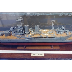  Scale built model of HMS Hood, wooden hull with plastic superstructure, guns and equipment, on stand in perspex display case with label 'Model built by Don Micklethwaite 2014', signed, L81cm, H23cm, D16cm and the Daily Telegraph Titanic Commemorative Reprint (2)   