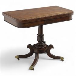 Regency rosewood fold over card table, the rectangular top with rounded corners and gadroo...