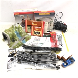  Hornby OO Gauge buildings and accessories comprising Country Station, R.334 Station Over Roof, R645 Single Track Level Crossing, R636 Double Track Level Crossing, transformer, track etc   