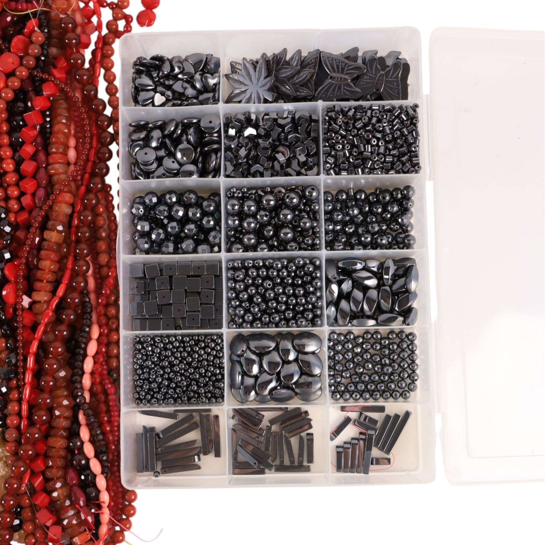 Seventy-six strings of polished gemstone and glass jewellery making beads and some loose beads, including black tourmaline quartz, sodalite, smoky quartz, mother of pearl, banded agate, jasper, maligano jasper, citrine, garnet etc, all of different cuts and sizes