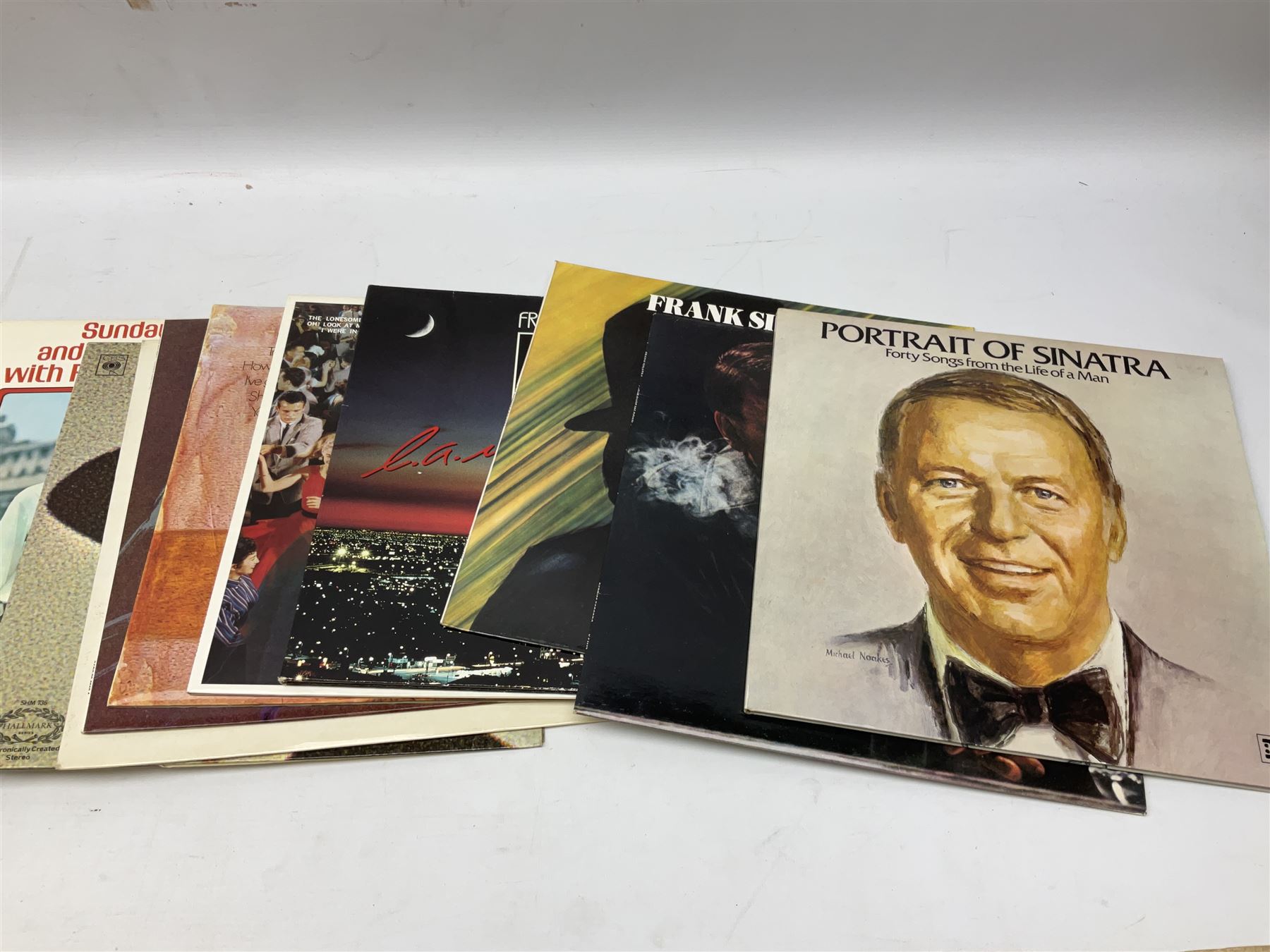 Collection of Frank Sinatra LP vinyl records, to include Sinatra Trilogy Past Present Future, Ol' blue eyes is back, My Way, etc., together with two books, The Sinatra Treasures by Charles Pignone, and Frank Sinatra by Jessica Hodge, plus a Beatles LP vinyl record, Love Songs, in one box
