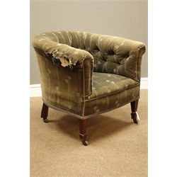  Edwardian tub shaped armchair, beech framed with sprung seat and buttoned back, square tapering supports with spade feet, brass castors  