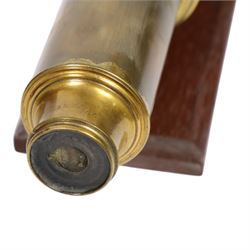 19th century single draw wooden telescope with brass mounts on a wooden stand, together with a mahogany and brass conical daylight enlarger and a B.I.T brass lens