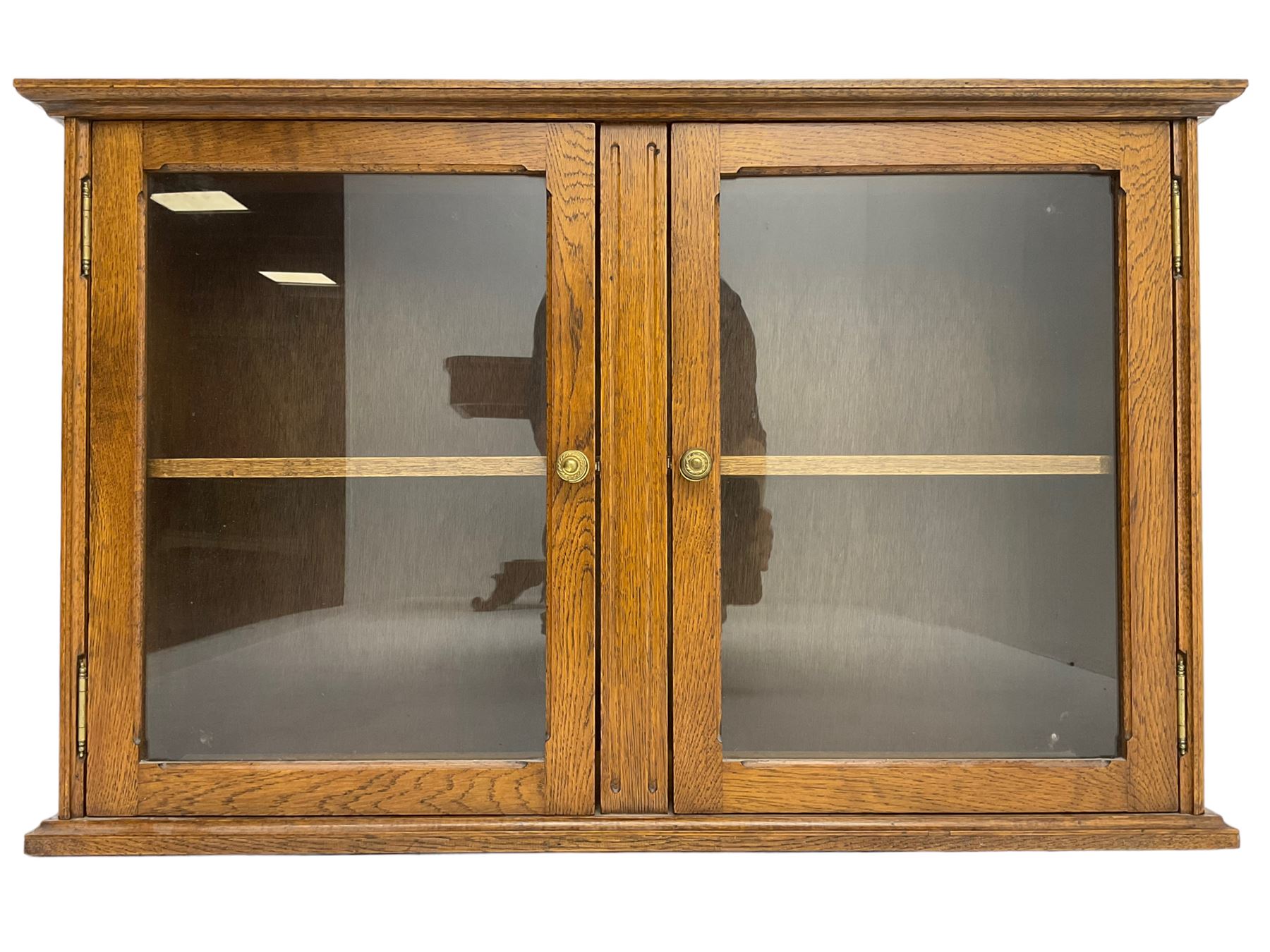 20th century low oak and glazed bookcase, double cupboard enclosing two shelves