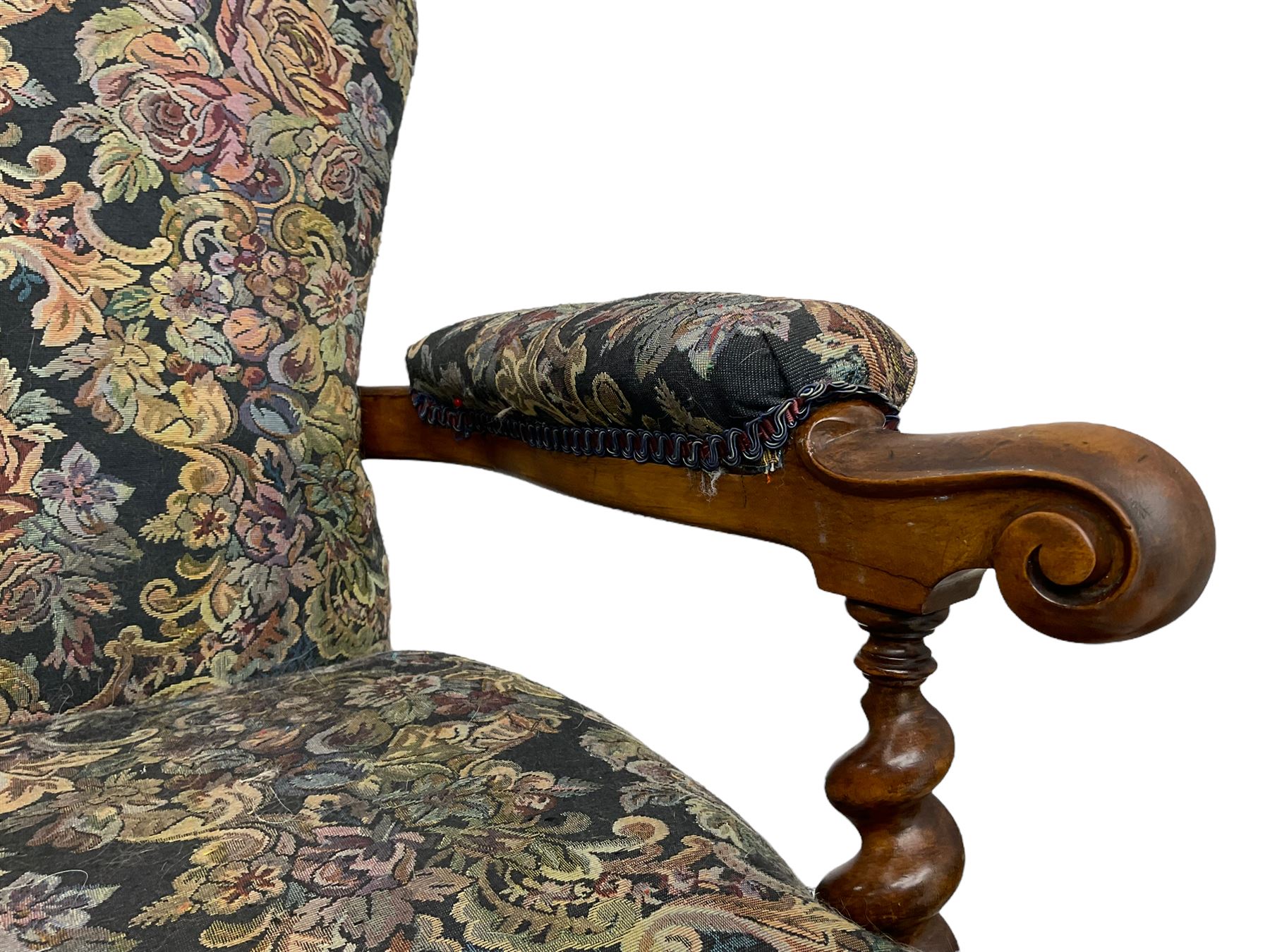 Victorian walnut framed open armchair, scrolled arm terminals over spiral turned arm supports, upholstered in foliate patterned fabric with sprung seat, on turned supports and brass castors (W65cm H92cm); and Victorian mahogany nursing chair with lobe carved supports (W60cm H92cm)