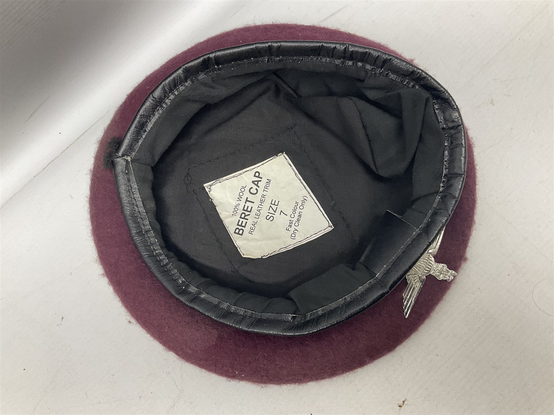 Four paratrooper berets - Russian, Italian, British and Foreign Legion; all with badges (4)