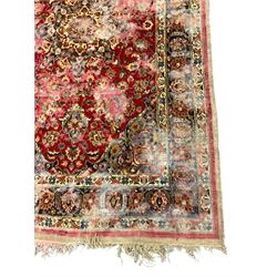 Antique Persian red ground rug, decorated with central pole medallion, guarded border with repeating palmettes