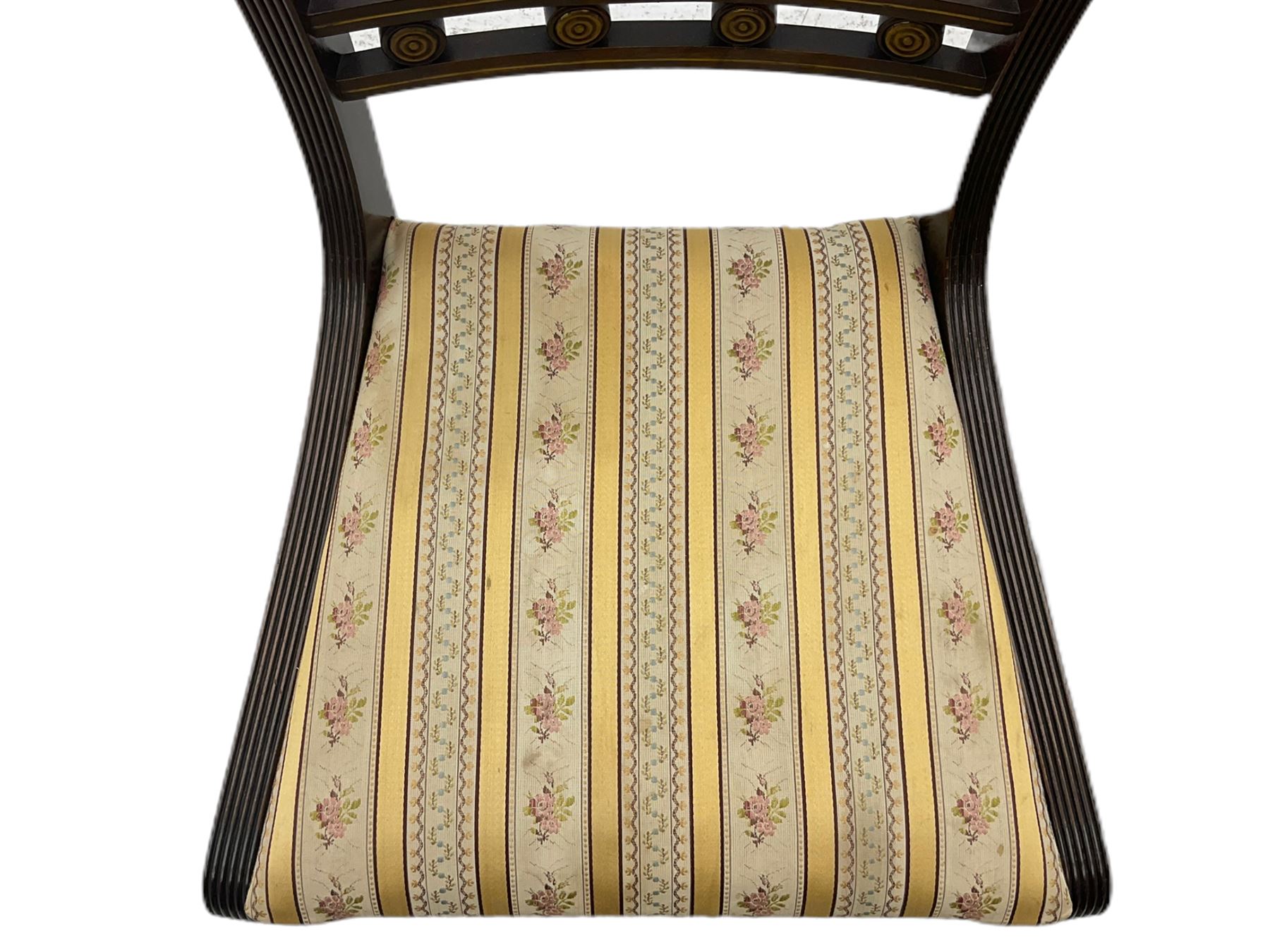 Set of eight Regency style mahogany dining chairs, brass inlay with gilded detail