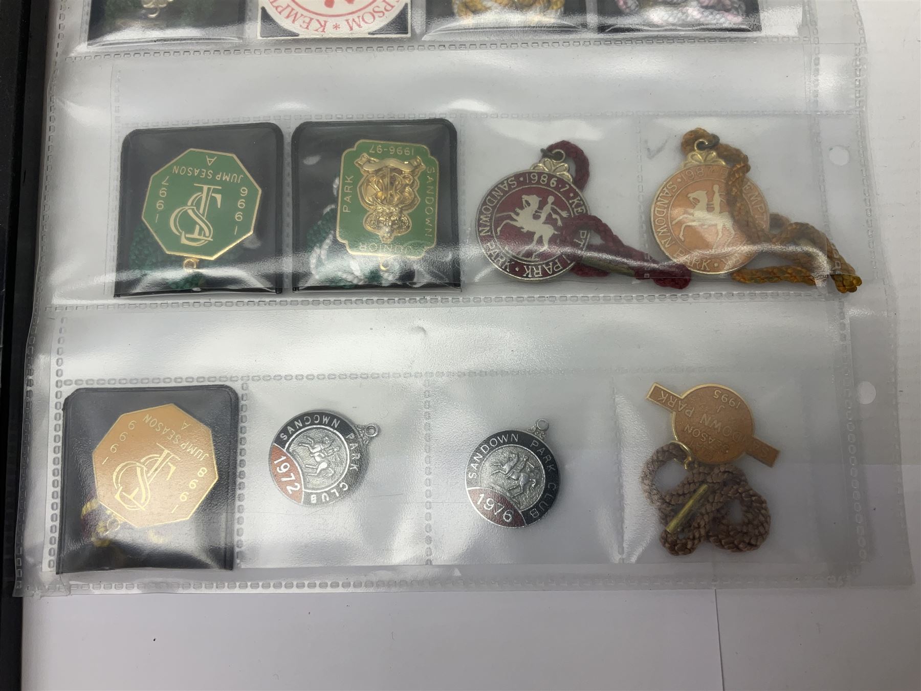 Enamel Horse racing members badges, together with three framed signed racing characters jockey prints, including Steve Smith Eccles, Willie Shoemaker and Greville Starkey, and one other print