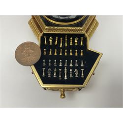Franklin Mint House of Faberge; The Imperial Jeweled Egg Chess set, the egg opening to reveal a chess board, with a draw to the hexagonal base holding the miniature chess pieces, H23cm 