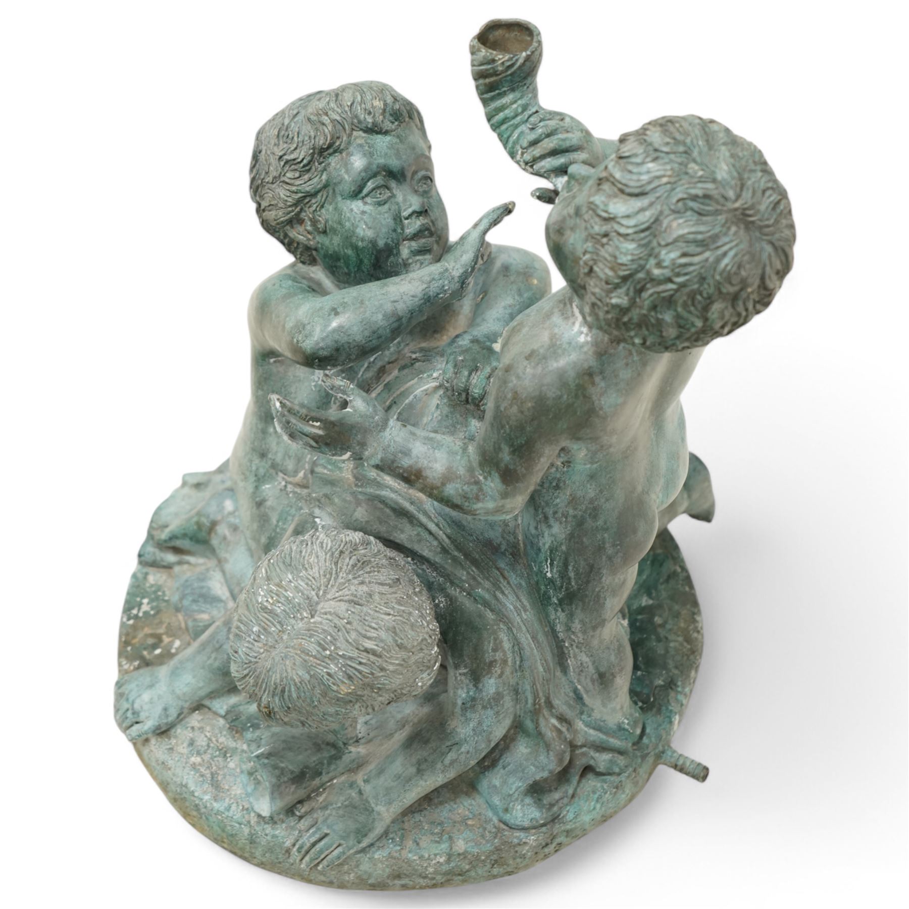 Cast bronze garden water fountain in the form of three Putti on circular naturalistic base, stamped 'Leonardo Rossi'  