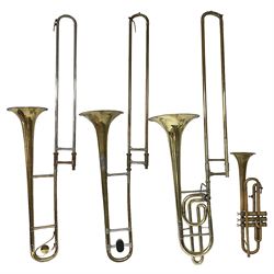 Three brass trombones comprising Elkhart