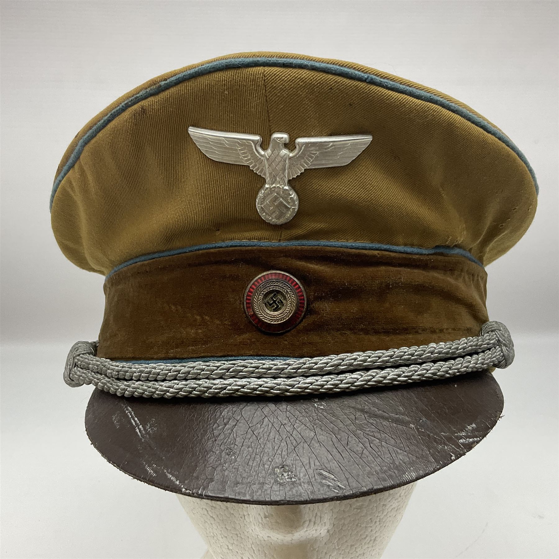 WW2 German Political Leaders brown cloth visor cap with metal insignia; labelled K. Hartel Weiden