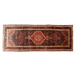 North West Persian Koliahee hand-knotted runner, indigo field with three large linked loze...