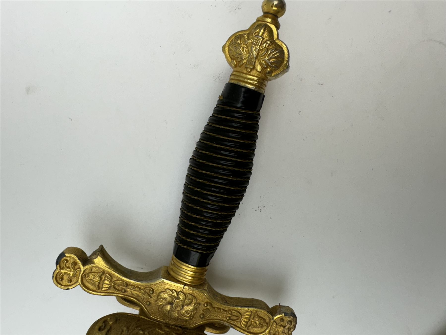 Ceremonial sword, the 75cm blade marked Toledo, Spain, gilt handle with black wire-bound grip  with leather scabbard with gilt tip, L94cm 