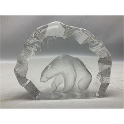 Two Mats Jonasson, Sweden paperweights, comprising polar bear in ice cave no 3152 and lion cubs, both with etched marks beneath, tallest H11.5cm