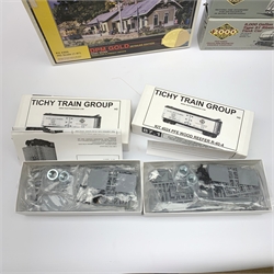 HO scale - nine American goods wagon plastic construction kits comprising three Proto 2000 Series Mather 40' Single Deck Stock Cars and 50 ton War Emergency Hopper, two Tichy Train Group 4024 Wood Reefers, two Athearn hopper wagons and Roundhouse Caboose; together with DPM Gold Coal River Passenger and Freight Depots and two Langley Miniature Models lorry kits, all boxed (12)
