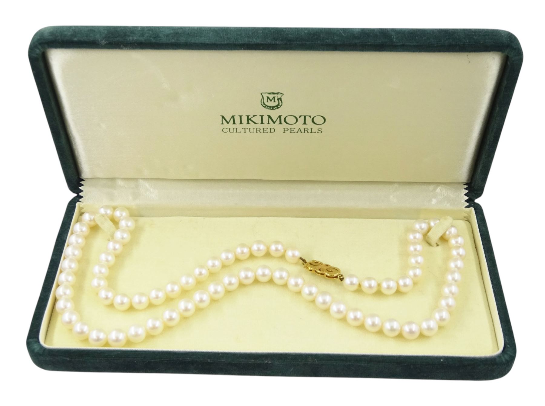 Mikimoto single strand cultured white pearl necklace, with 18ct gold clasp, stamped 750, boxed with certificate dated 1983