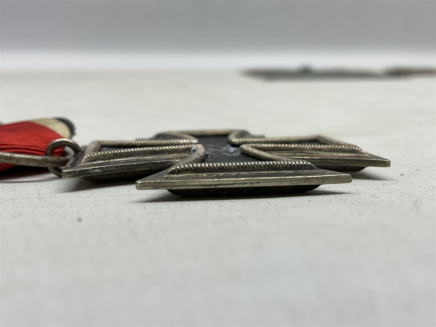 WW2 German Iron Cross 2nd Class with ribbon, ring stamped 44; and original issue packet; together with a copy of a WW2 Iron Cross