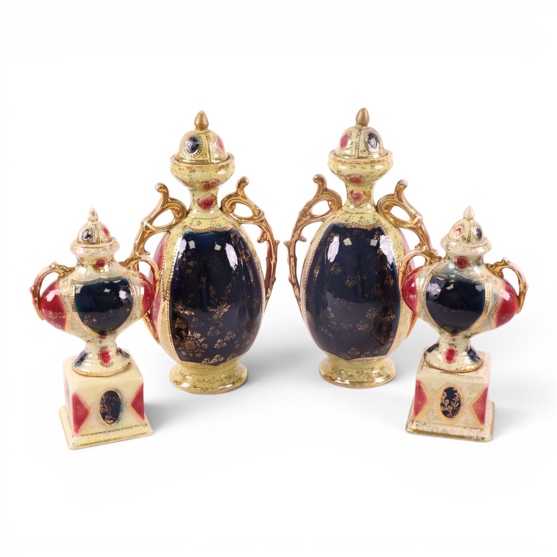 Pair of Royal Vienna twin handle vases with covers the central panel with shepherdesses together with another pair 