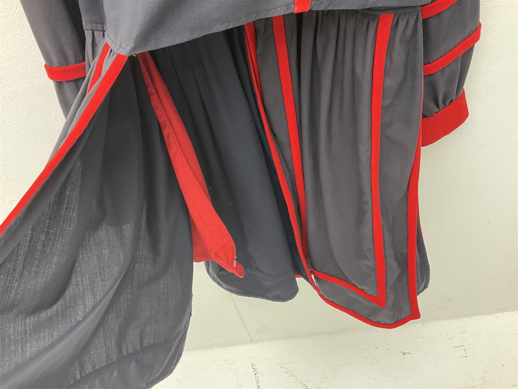 Elizabeth II Yeoman Warders (Beefeater) No.1 Undress blue uniform - comprising tunic bearing label Crown Military Uniforms H.M. Tower of London and bonnet by S. Patey (2) 