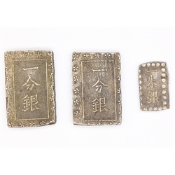  Two Japanese silver 'Tenpo Ichibugin'/'Old Ichibugin' both weighing approximately 8.66 grams and a silver 'Isshuban' weighing approximately 1.84 grams  