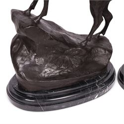 After Jules Moigniez (French 1835-1894): Pair of bronze stag figures on marble bases, each modelled alert standing on moulded rocky plinth on shaped marble bases, H74cm