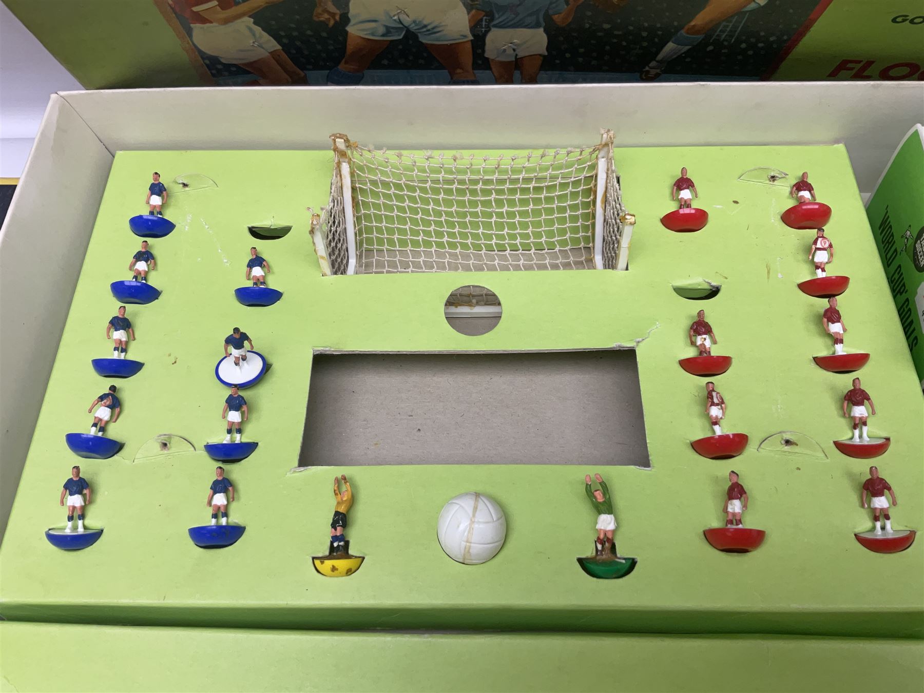 Subbuteo - three boxed sets comprising Football Express with two five-a-side teams and floodlighting; Continental with four teams and accessories; and International Edition Table Rugby with two teams; together with a Real Madrid 1974-75 League Champions pennant (4)