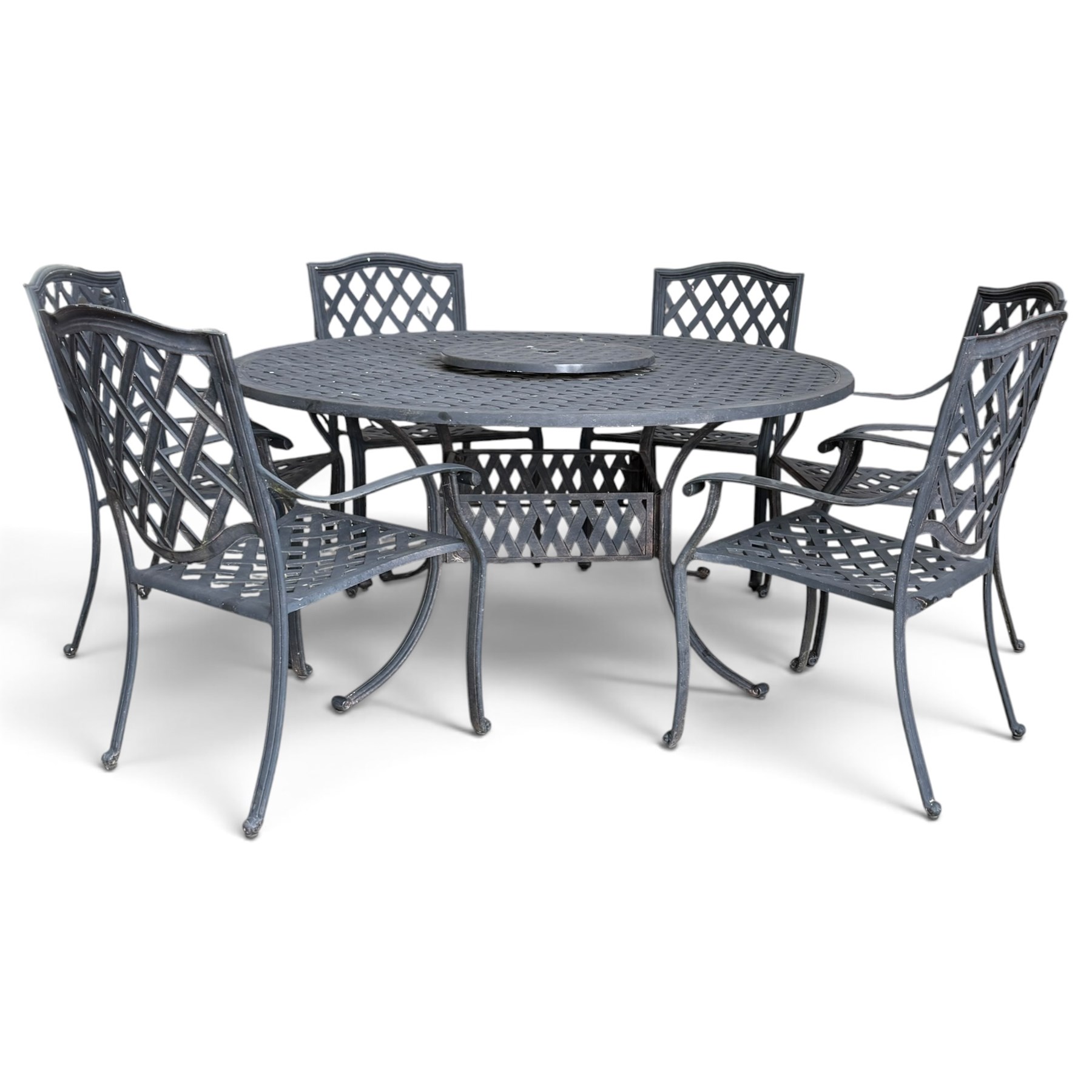 Grey-painted cast metal garden dining suite, comprising circular latticework table on splayed supports (W152cm H72cm), and six matching open armchairs with lattice backs and seats (W61cm H93cm)