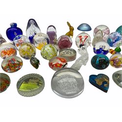 Glass paperweights to include Caithness, Firefly glass, Mdina and others, mostly unmarked, together with Murano glass animals, scent bottle etc in two boxes
