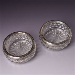 Pair of silver navette shape salts , cased Birmingham 1900 Maker Mitchell Bosley & Co., silver three piece condiment set, pair of silver cornucopia shape salts, silver upright photograph frame 17cm x 13cm and a pair of glass salts with silver rims