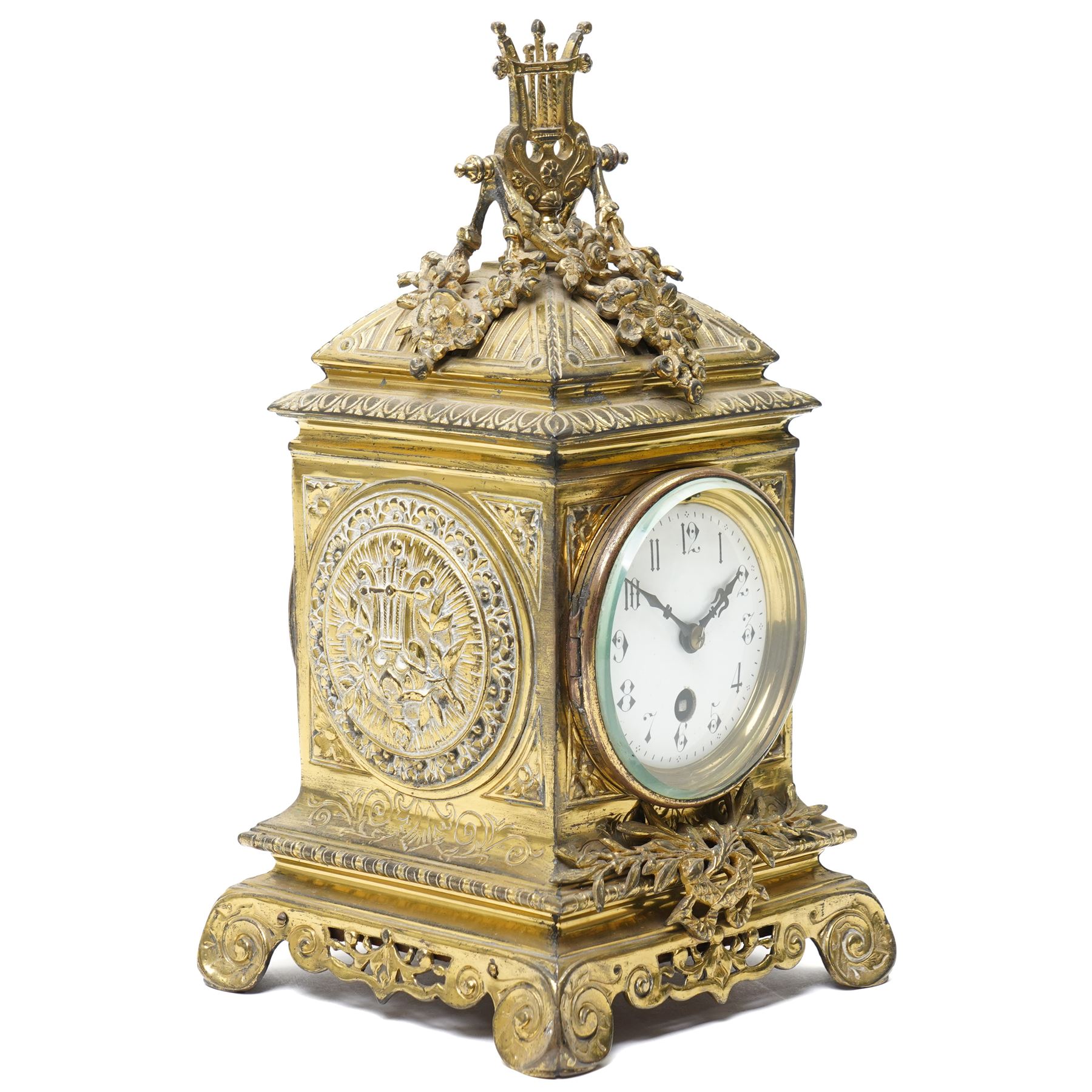 Early 20th century mantel clock with white enamel dial, French timepiece movement and recoil anchor escapement in brass case with lyre finial, trailing garlands and wreaths etc on scroll feet H30cm 
Provenance: property of a Nobleman