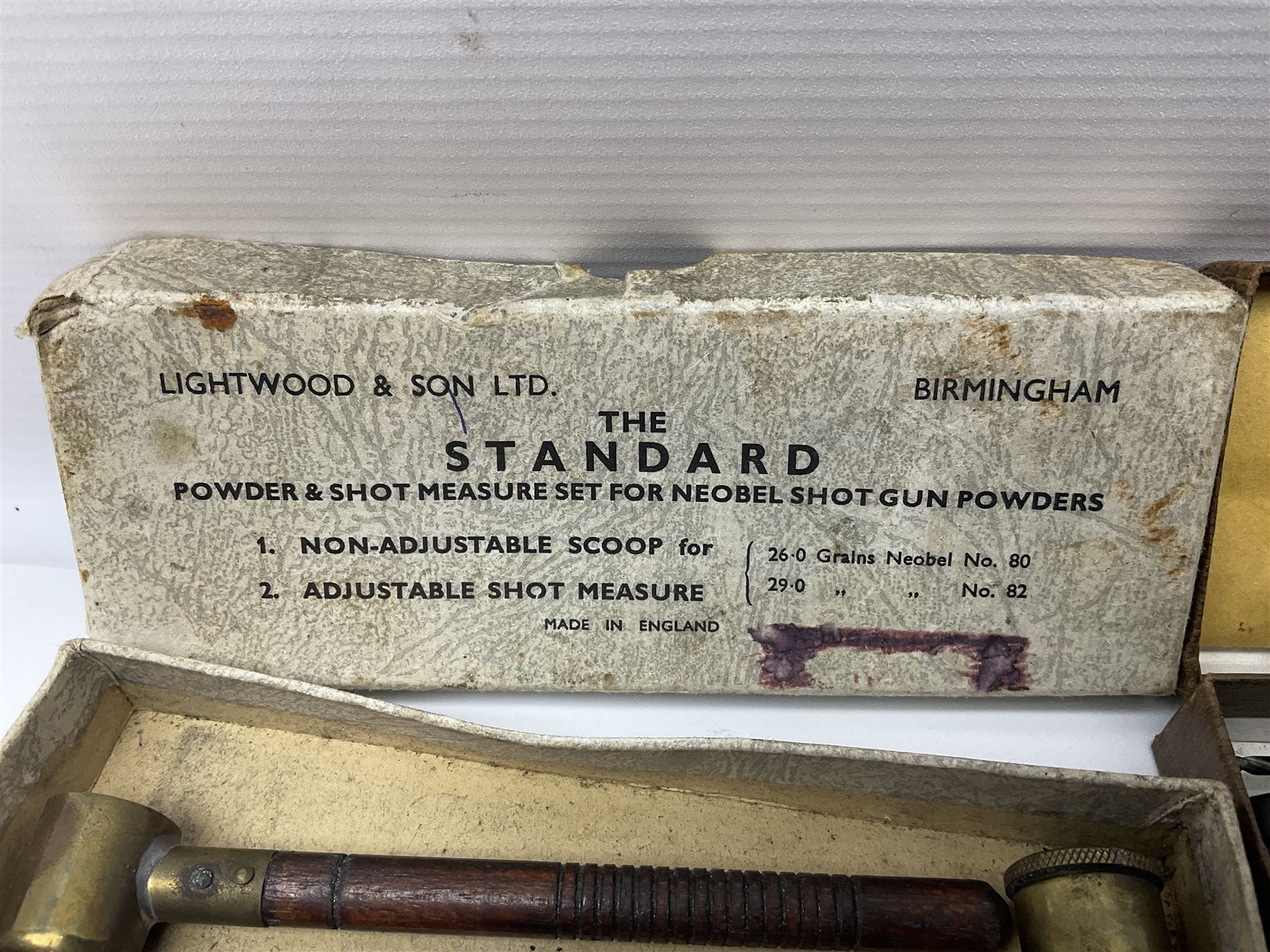 Six pairs of revolver grips;  pair of Lightwood & Son Ltd powder/shot measures in original box; and boxed Colt hammer shroud 