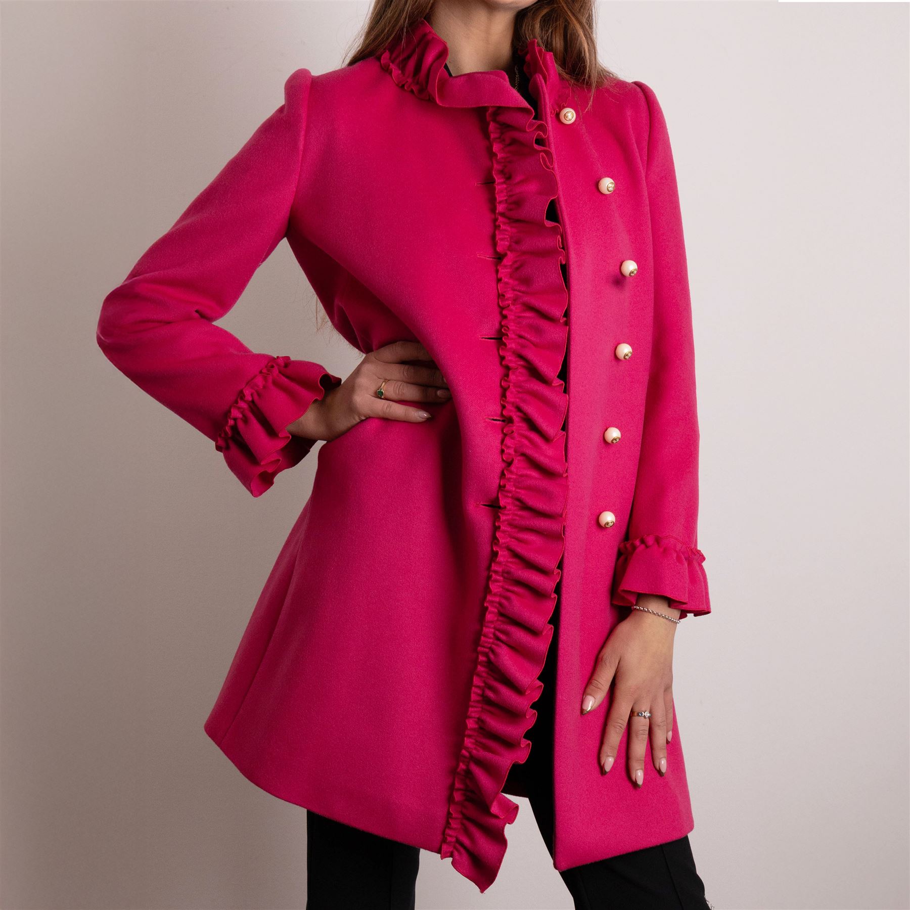Gucci - wool ruffle-front single-breasted coat in bright fuchsia pink, with high ruffled collar, cascading ruffle trim to the front, collar and cuffs, faux pearl and gilt GG monogram logo button fastening, size 44, unused with the original garment bag and hanger