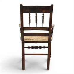19th century elm chair, with curved top rail and bobbin turned spindles, woven rush seat, on turned legs united by front stretcher