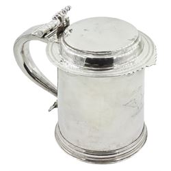 Queen Anne silver tankard, of plain tapering cylindrical form, with stepped and flat-domed cover, twit cast thumbpiece and curved handle, the body engraved with eagle crest, hallmarked Abraham Barachin, Hull, circa 1706, the body and cover stamped once with makers mark and twice with town mark, H18cm, approximate weight 21.46 ozt (667.7 grams)
