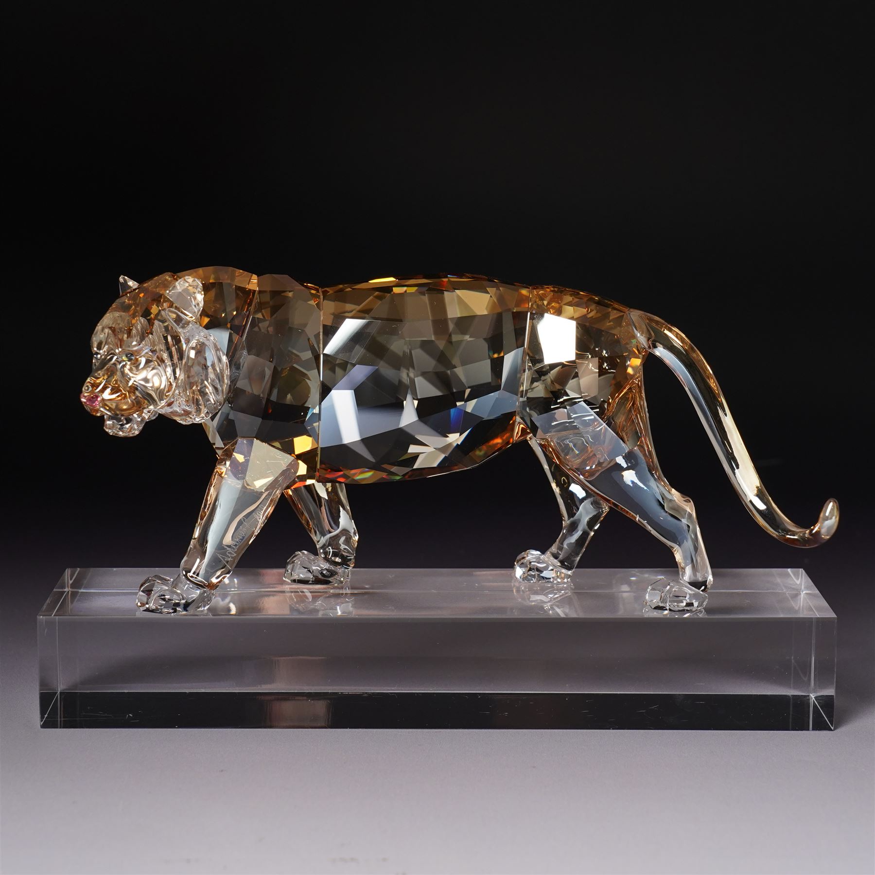 Swarovski, Endangered Wildlife, Tiger and two cubs, each with box, together with glass stands 