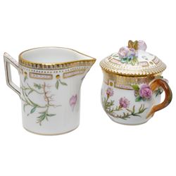 Royal Copenhagen Flora Danica wares, comprising covered mustard pot with naturalistically modelled vine handles and decorated with Cushion Pink (Cucubalius Acaulis) H8cm, milk jug decorated with Maiden Pink (Dianthus Deltoides) H7cm, covered dish decorated with Dwarf Milkwort (Polygala Amarum) W8cm, oval salt cellar decorated with Alpine Squill (Scilla Bifolia) W11cm, egg cup, pin dish and cased hand mirror, various Latin specimen inscriptions to base, all with printed and painted marks beneath (7)