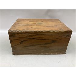 Oak canteen case with recessed twin drop carry handles, the hinged cover opening to reveal a canteen interior, above two pull our drawers, H25.5cm, (vacant), and two part canteens of Community plate cutlery