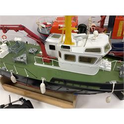Two remote controlled kit-built plastic model boats - RNLB Sheerness Lifeboat Helen Turnbull L92cm and 'Conserver' Grangemouth L76cm; each on wooden stand; together with three remote control units