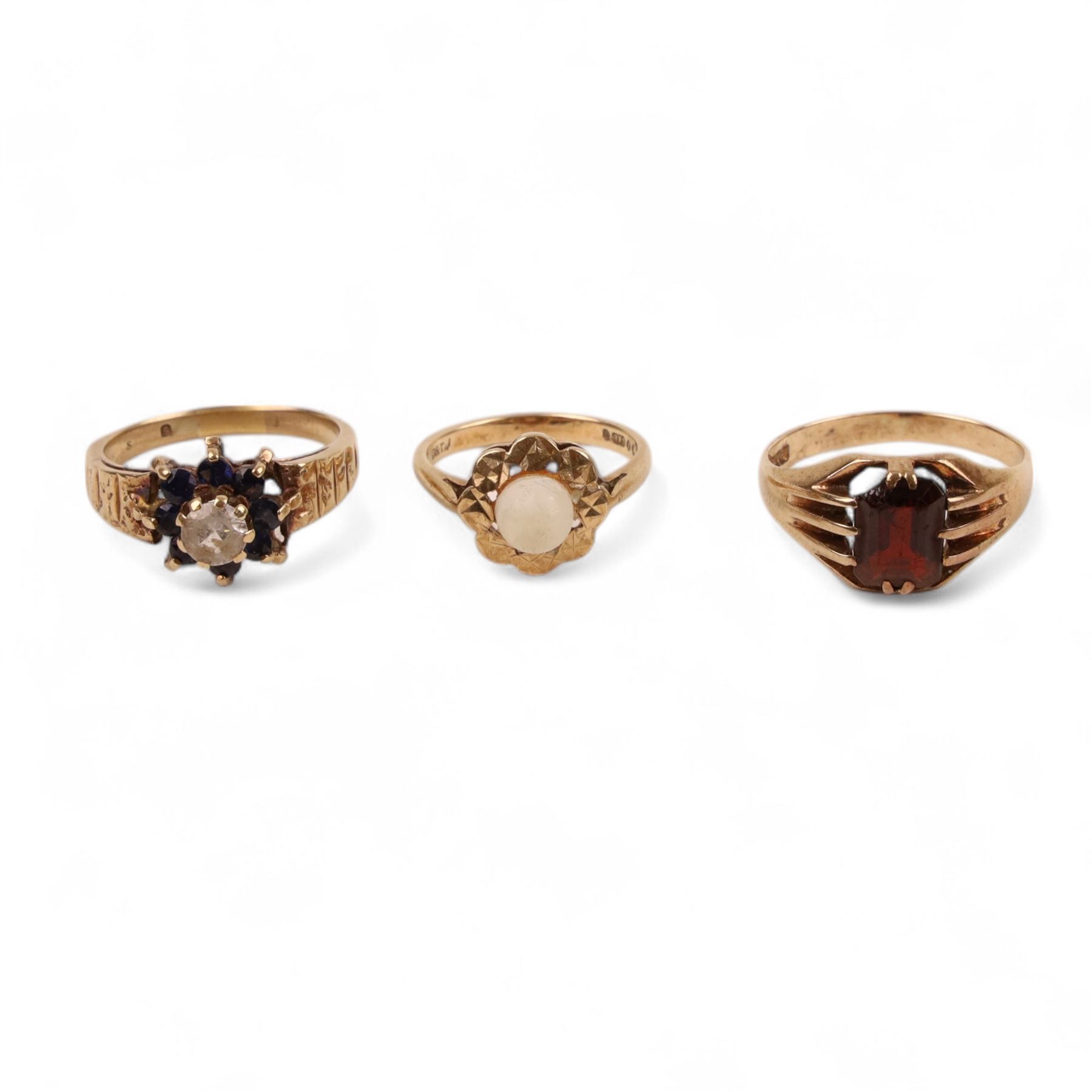 Three 9ct gold stone set rings including garnet and paste stone