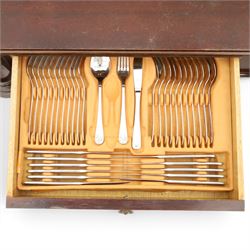 Mahogany cased canteen of Solingen cutlery, raised upon turned legs