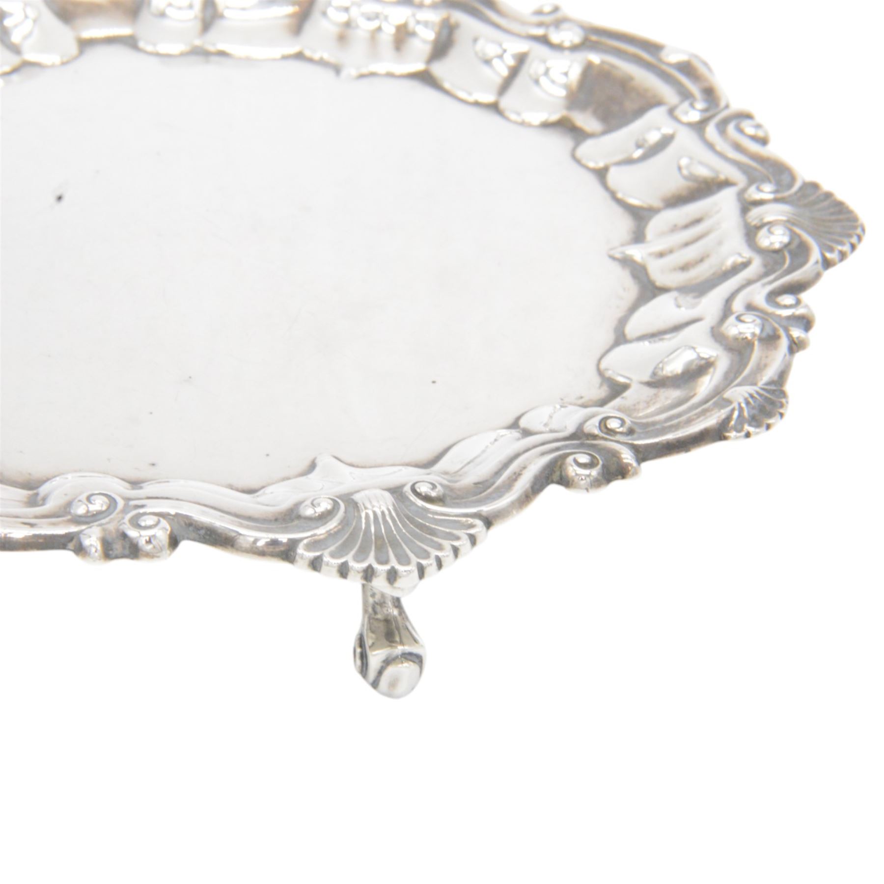 Edwardian silver waiter, of typical form with palmette and C scroll rim, upon three scroll feet, hallmarked Chester 1909, maker's mark MEB over FEB, W23cm