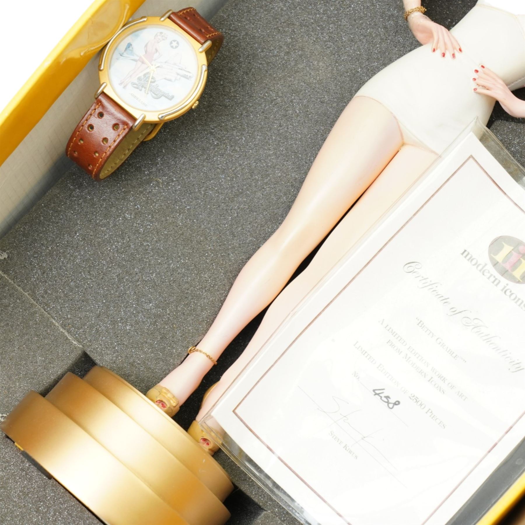 Betty Grable -  A purse designed as a bunch of violets and used by Betty Grable in the film 'Sweet Rosie O'Grady' 1943 and won in a competition in the Sunday Pictorial newspaper by Beth Jackson with newspaper cuttings, letter, photographs etc, together with a limited edition figure of Betty Grable by Modern Icons 458/2500, with magazines, books and other items relating to Betty Gable